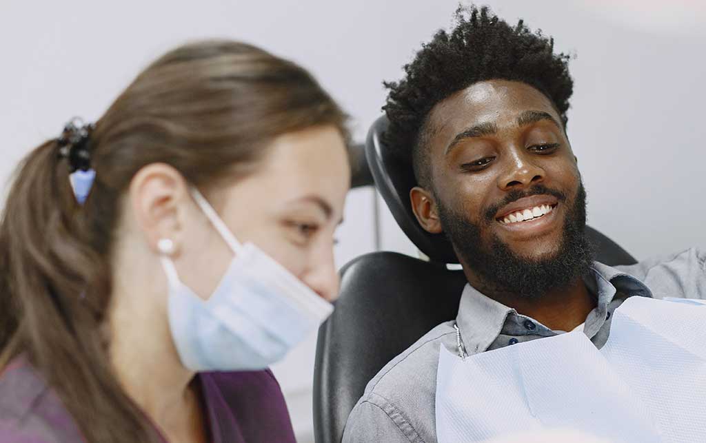 man with hygienist